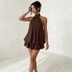 Halter Mini Dress | Transform each uploaded image into a high-end fashion studio photograph while preserving the original model and dress exactly as they are.